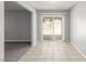 Dining room with tile flooring and sliding glass door to backyard at 2432 Spanish Ct, Las Vegas, NV 89108