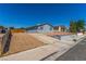 Street view featuring a tidy residence with neutral tones and easy access to the driveway and walkway at 2432 Spanish Ct, Las Vegas, NV 89108