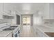 Bright kitchen with white cabinets, countertops, and tile flooring at 2432 Spanish Ct, Las Vegas, NV 89108