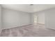 Open living room featuring neutral walls and clean carpeting at 2432 Spanish Ct, Las Vegas, NV 89108