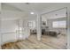 Open landing leads to a primary bedroom with neutral decor and ample space for a seating area at 2573 Rafferty Creek Ln, Las Vegas, NV 89156