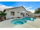 Exterior of home featuring pool, spa, and covered patio at 2714 Langlade Ave, Henderson, NV 89052