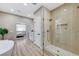 Contemporary bathroom featuring glass shower, tiled walls, and modern fixtures at 2714 Langlade Ave, Henderson, NV 89052