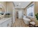 Modern bathroom with double vanity, standalone tub, and large window at 2714 Langlade Ave, Henderson, NV 89052