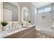 Elegant bathroom showcasing double sinks, modern fixtures, and a bath shower at 2714 Langlade Ave, Henderson, NV 89052