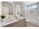 Bathroom boasts a double vanity, bright mirrors, and tub/shower combo at 2714 Langlade Ave, Henderson, NV 89052