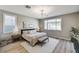 Cozy bedroom with a large window, soft lighting, and neutral color palette at 2714 Langlade Ave, Henderson, NV 89052