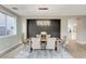 Elegant dining room boasting modern lighting, stylish chairs, and wood-look floors at 2714 Langlade Ave, Henderson, NV 89052