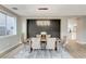 Beautiful dining room with modern light fixture and dark accent wall, perfect for entertaining at 2714 Langlade Ave, Henderson, NV 89052