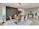 Elegant dining room featuring stylish chairs, modern light fixture, and a dark accent wall at 2714 Langlade Ave, Henderson, NV 89052