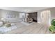 Spacious living and dining room with modern decor and a calming color palette at 2714 Langlade Ave, Henderson, NV 89052