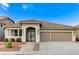 Charming single-story home with a well-maintained front yard, tiled roof, and spacious three-car garage at 2714 Langlade Ave, Henderson, NV 89052