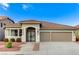 Charming home featuring a well-manicured front yard, two-car garage, and beautiful tile roof at 2714 Langlade Ave, Henderson, NV 89052