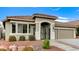 Charming single-story home showcasing a tile roof, gated entry, and two car garage at 2714 Langlade Ave, Henderson, NV 89052
