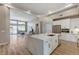 Open-concept kitchen with island, stainless steel appliances, and view into the living room at 2714 Langlade Ave, Henderson, NV 89052