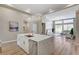 Open kitchen showcases a large island with seating, stainless steel dishwasher, and modern finishes at 2714 Langlade Ave, Henderson, NV 89052