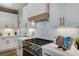 Modern kitchen featuring white cabinets, stainless appliances, and marble countertops at 2714 Langlade Ave, Henderson, NV 89052