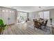 Bright living and dining area featuring modern furnishings and large windows at 2714 Langlade Ave, Henderson, NV 89052