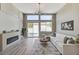 Bright living room boasts a modern fireplace, contemporary furnishings, and access to the pool area at 2714 Langlade Ave, Henderson, NV 89052