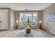 Inviting living room featuring two armchairs, a bay window, and neutral decor at 2714 Langlade Ave, Henderson, NV 89052