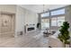 Bright living room with tall windows, a modern fireplace, and comfortable seating at 2714 Langlade Ave, Henderson, NV 89052