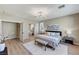 Spacious main bedroom with a view of the ensuite bathroom, a comfortable bed, and a stylish decor at 2714 Langlade Ave, Henderson, NV 89052