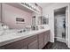 Bathroom featuring double sinks and a walk-in shower with built-in shelving at 2725 S Nellis Blvd # 1038, Las Vegas, NV 89121