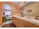 Bright bathroom with a double sink vanity, decorative accents, and warm lighting at 2725 S Nellis Blvd # 1038, Las Vegas, NV 89121