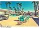 Community pool and sun lounging area with palm trees at 2725 S Nellis Blvd # 1038, Las Vegas, NV 89121