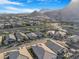 Expansive aerial view of the neighborhood showcasing mountain backdrop at 2771 Free Formed Ct, Las Vegas, NV 89138