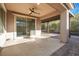 Covered back patio featuring a ceiling fan with sliding glass door access to the home at 2771 Free Formed Ct, Las Vegas, NV 89138