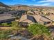 Aerial view of a backyard with patio cover, lawn, and brick fence at 2771 Free Formed Ct, Las Vegas, NV 89138