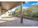 Paver patio area with a covered pergola, and retaining wall with lush landscaping at 2771 Free Formed Ct, Las Vegas, NV 89138