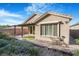 Exterior view of the house highlighting landscaping, and covered patio at 2771 Free Formed Ct, Las Vegas, NV 89138