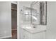 Stylish bathroom featuring a vanity, a decorative mirror, and modern fixtures at 2771 Free Formed Ct, Las Vegas, NV 89138