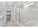Modern bathroom featuring a large glass shower enclosure and a walk-in closet at 2771 Free Formed Ct, Las Vegas, NV 89138