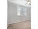 Bright bedroom features a modern ceiling fan, shutters, and wood-look tile flooring at 2771 Free Formed Ct, Las Vegas, NV 89138