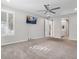 Bedroom with carpeted floors, a wall-mounted television, and an ensuite bathroom at 2771 Free Formed Ct, Las Vegas, NV 89138