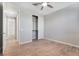 Neutral bedroom with a closet, tile flooring, and ceiling fan at 2771 Free Formed Ct, Las Vegas, NV 89138