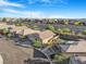 Lovely neighborhood with houses on tiered terrain and blue skies at 2771 Free Formed Ct, Las Vegas, NV 89138