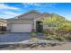 Charming single-story home with a manicured front yard and a two-car garage at 2771 Free Formed Ct, Las Vegas, NV 89138