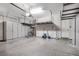 Spacious garage featuring built-in storage cabinets and overhead racks at 2771 Free Formed Ct, Las Vegas, NV 89138