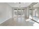 Living room featuring large windows looking out to the backyard, plus sliding door access at 2771 Free Formed Ct, Las Vegas, NV 89138