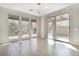 Bright living room showcasing three large windows and sliding door to the backyard at 2771 Free Formed Ct, Las Vegas, NV 89138