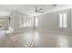 Spacious living room featuring tile flooring and large windows with plantation shutters at 2771 Free Formed Ct, Las Vegas, NV 89138
