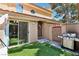 Private back patio with artificial turf, grill, and door leading to the interior at 2830 Crystal Lantern Dr, Henderson, NV 89074