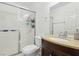 Bathroom featuring a shower with sliding glass door and dark wood vanity at 2830 Crystal Lantern Dr, Henderson, NV 89074