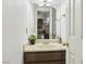 Half bath features a sleek vanity, decorative mirror, and stylish fixtures at 2830 Crystal Lantern Dr, Henderson, NV 89074