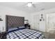 This bedroom features a large, tufted headboard and a vanity with decorative accents at 2830 Crystal Lantern Dr, Henderson, NV 89074