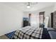 Well-lit bedroom featuring a ceiling fan, comfortable bed, and a view of a TV on the dresser at 2830 Crystal Lantern Dr, Henderson, NV 89074